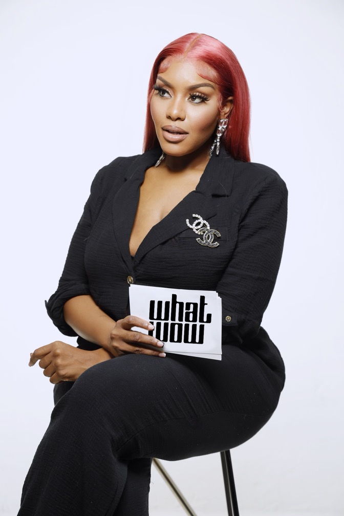 Nikki Allure holding her WhatWow interview cards